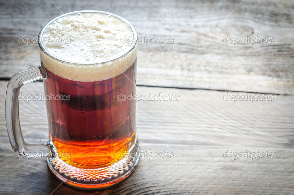 depositphotos_48639433-Mug-with-dark-beer-on-the-wooden-table.jpg